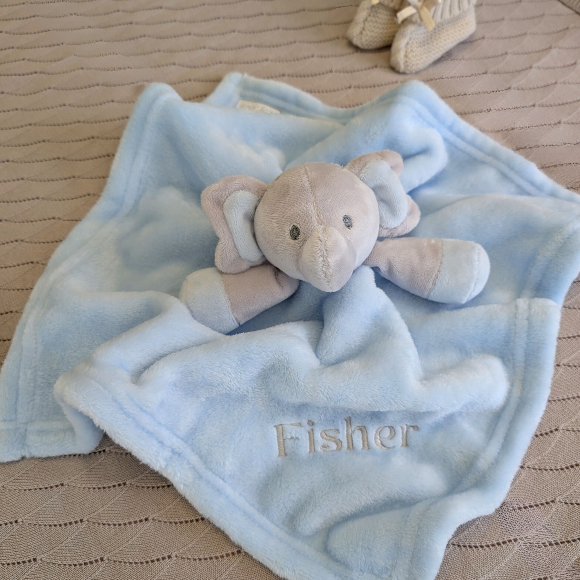 Personalised blue elephant soft toy comforter for a baby.