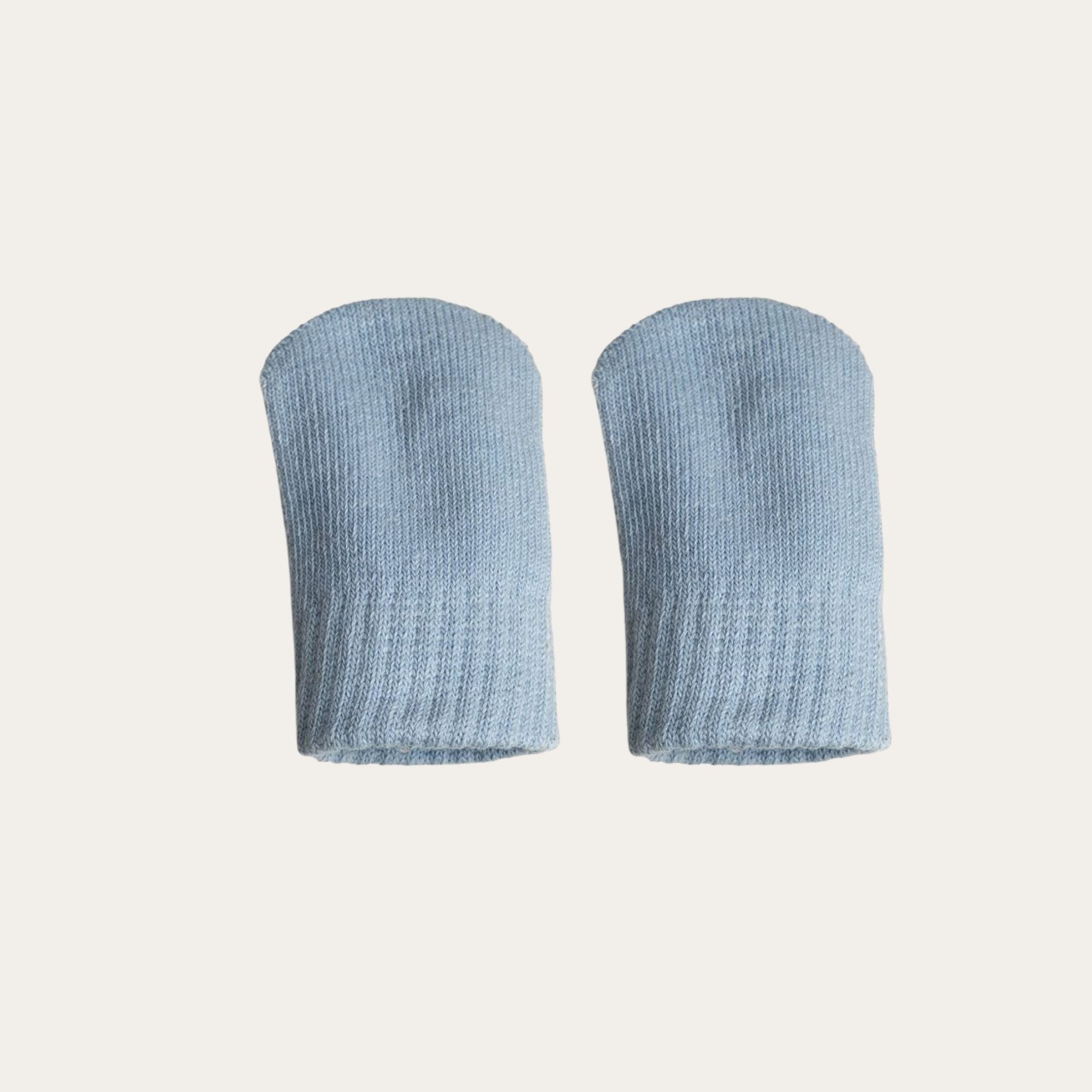 A pair of 100% brushed cotton mittens in a soft light blue