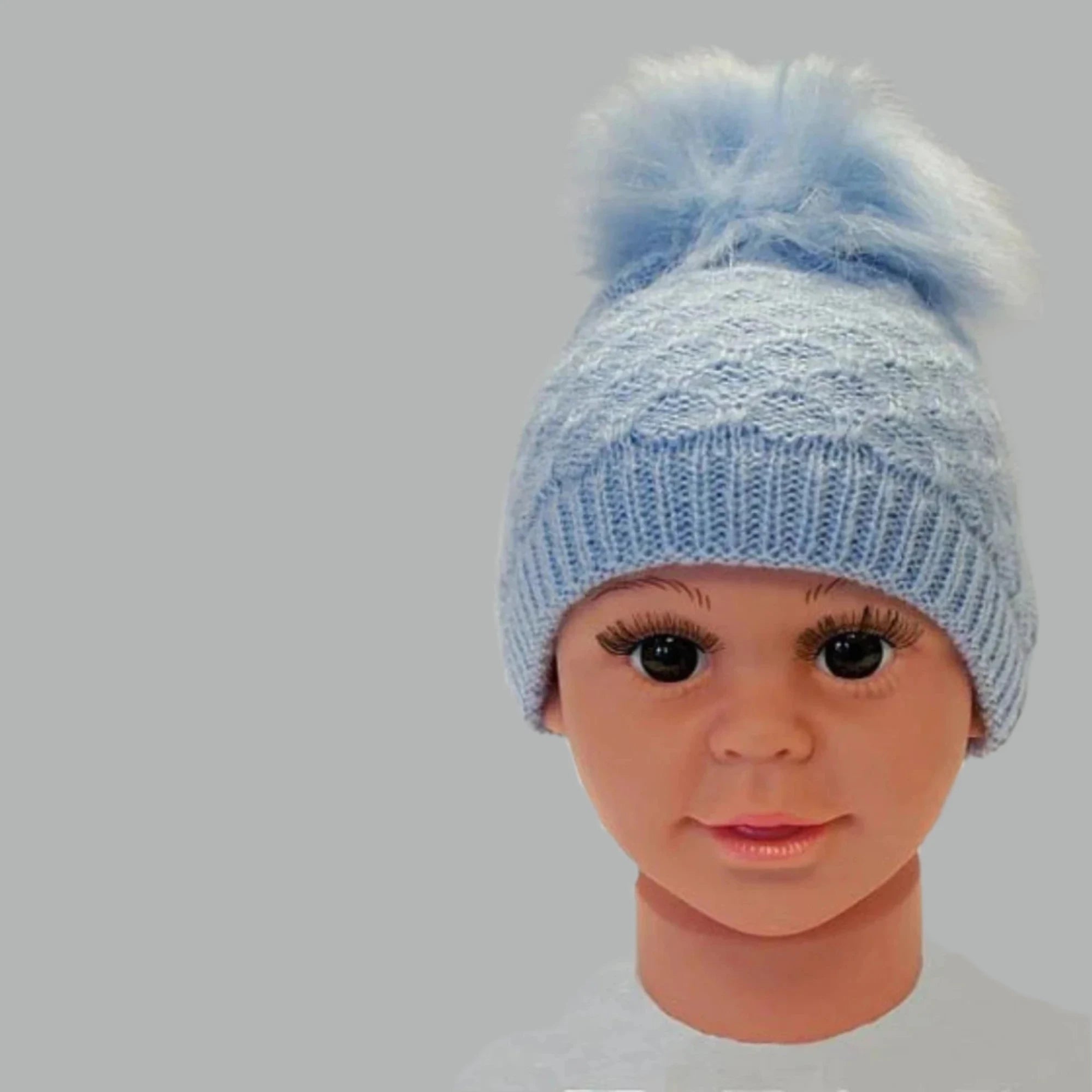 Soft blue knitted blue pompom hat