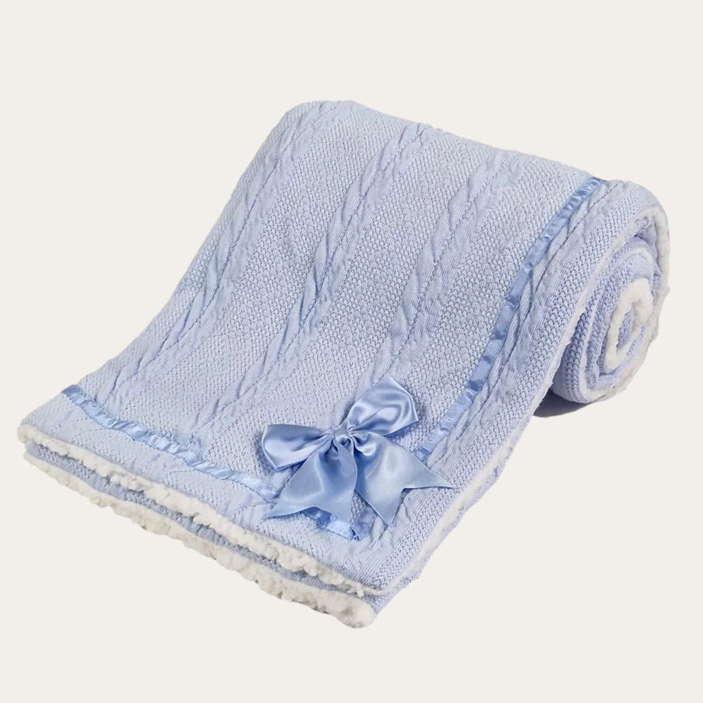 Blue Sherpa Back Knit Blanket folded neatly, showing the satin bow