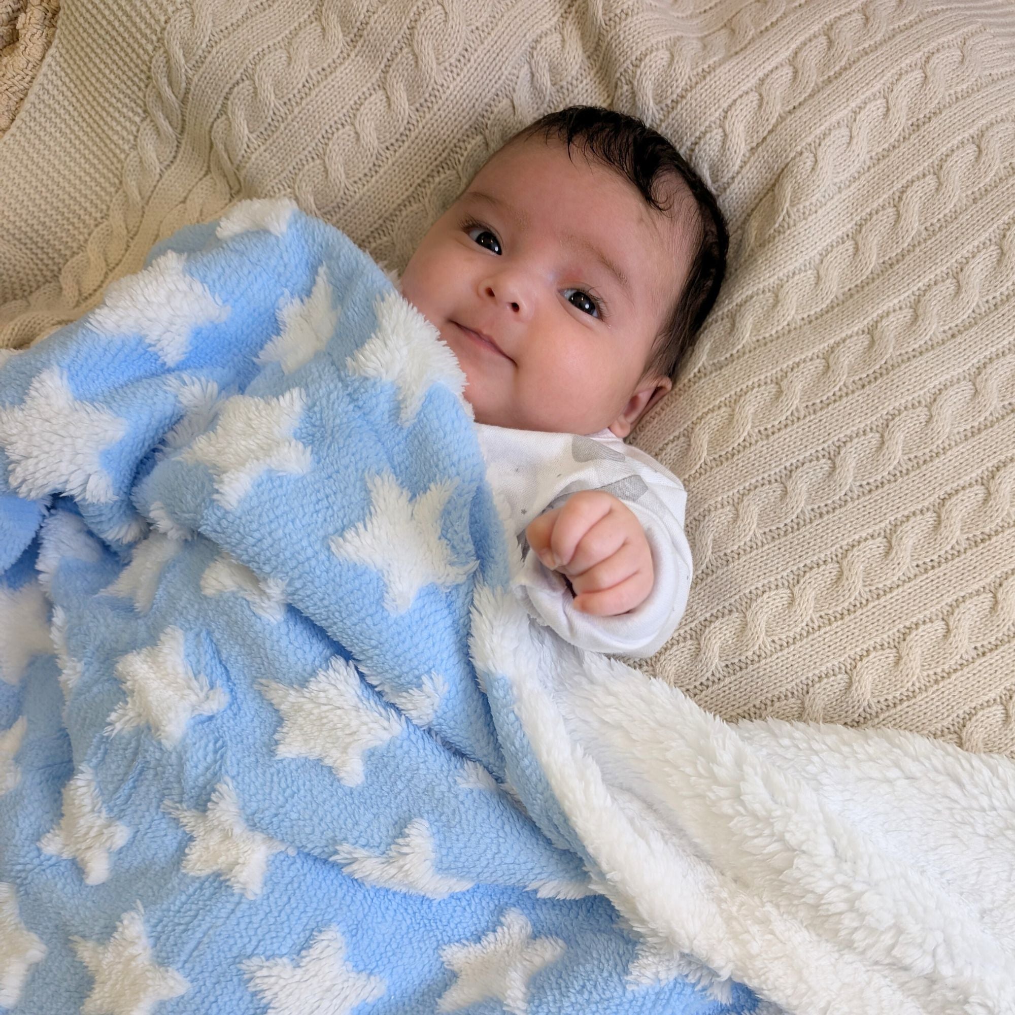 baby blanket in blue with white stars and a fleece background bumbles and boo