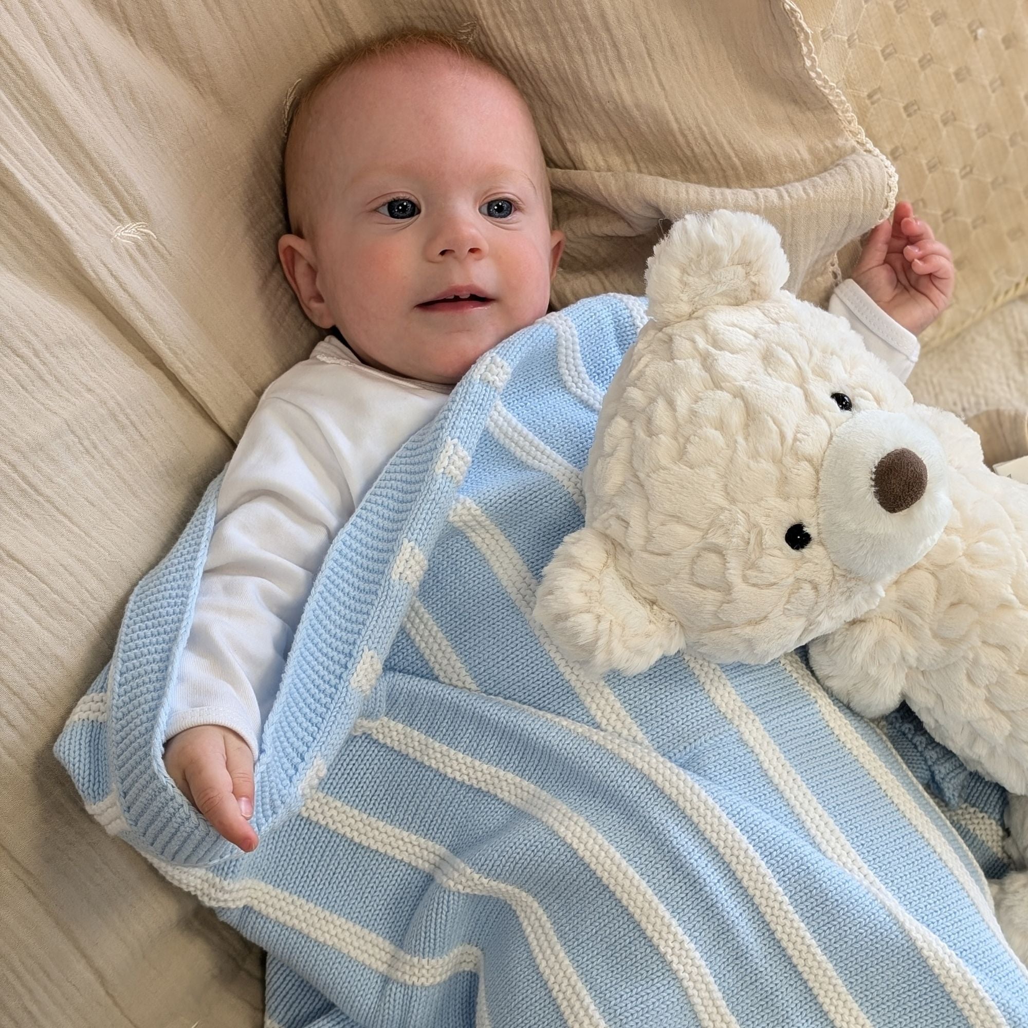 blue and white knit stripe baby blanket in cotton