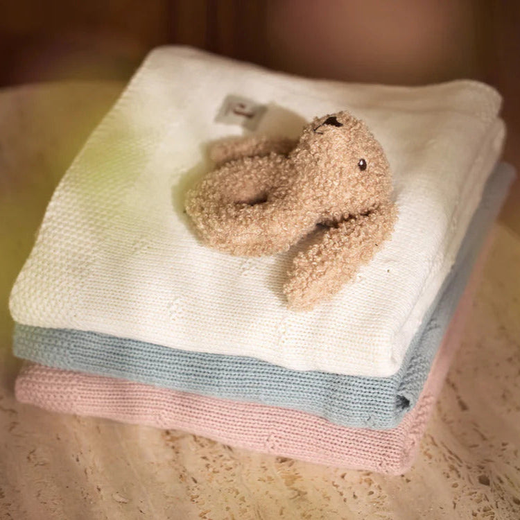 Rattle Bunny Riverside in soft biscuit-coloured bouclé fabric with heart nose detail.