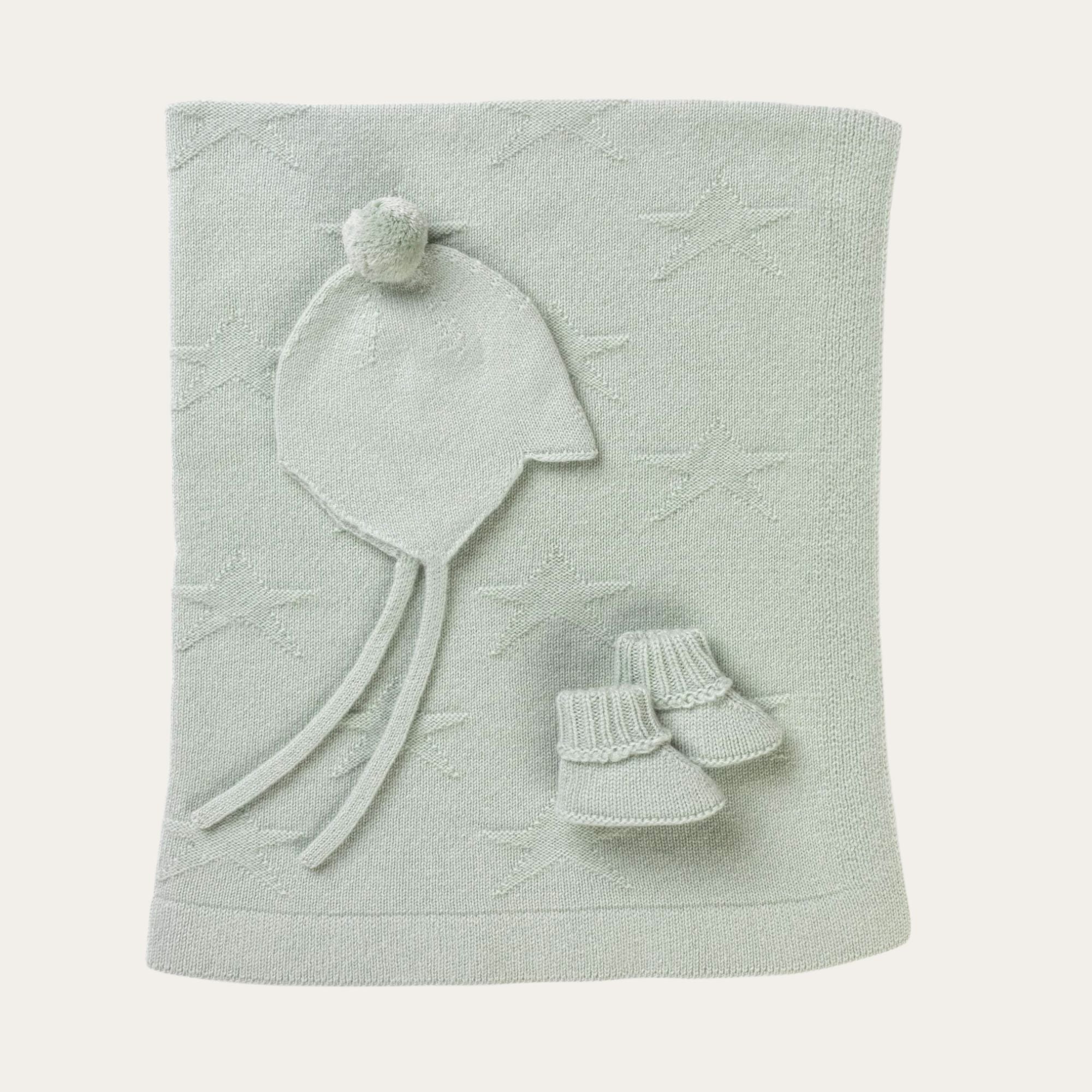 Beautiful cashmere gift set in duck egg blue / green. Comprises of super soft blanket with star detail, adorable baby booties and aviator style hat with bobble. 