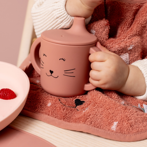 Easy-Grip Mrs Cat Sippy Cup with ergonomic handles for toddlers, designed for spill-free sipping and convenience for on-the-go parents.