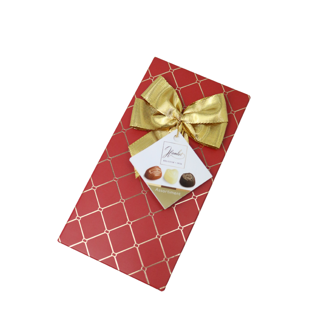 wrapped in red paper with a gold bow chocolate assortment box