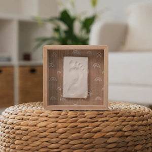 Close-up of the Clay Footprint Frame with rainbow backing and baby footprint