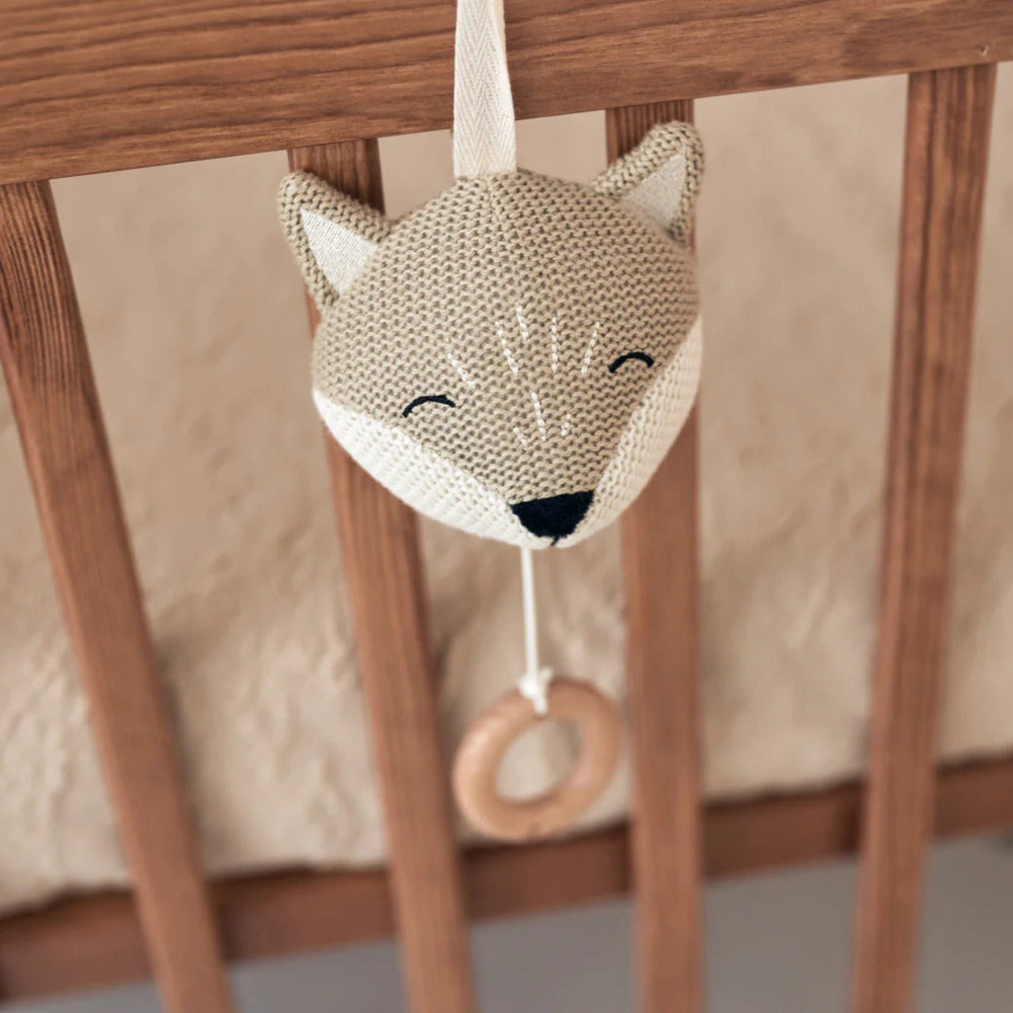 Musical Fox with pull string, plays “Sleep, Dear Child, Sleep,” ideal for soothing babies.