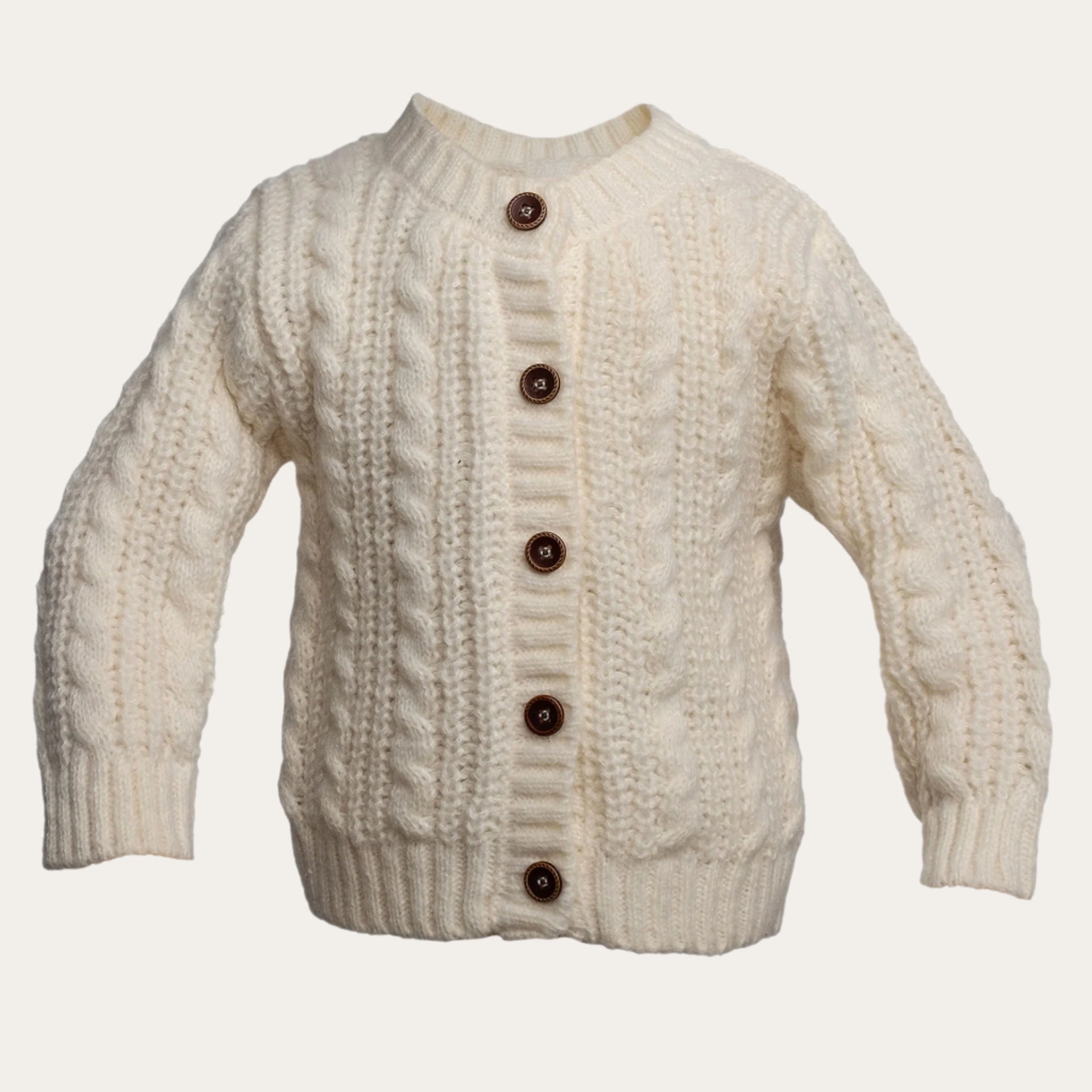 Long sleeved cream knitted cardigan for babies – classic and cosy