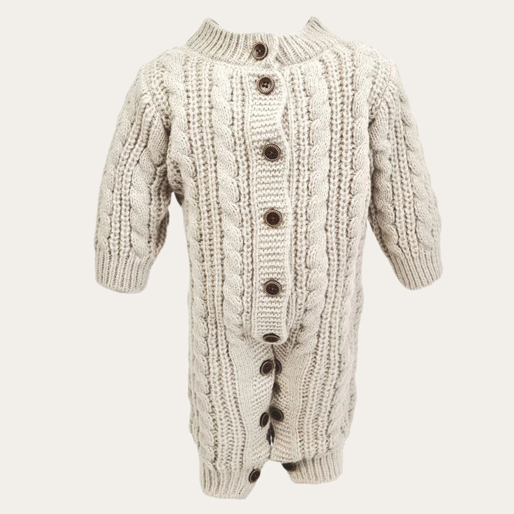 cream knitted cable baby romper with long sleeves and button details