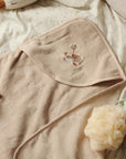 Organic Hooded Baby Towel with deer motif on the hood. A neutral beige colour.