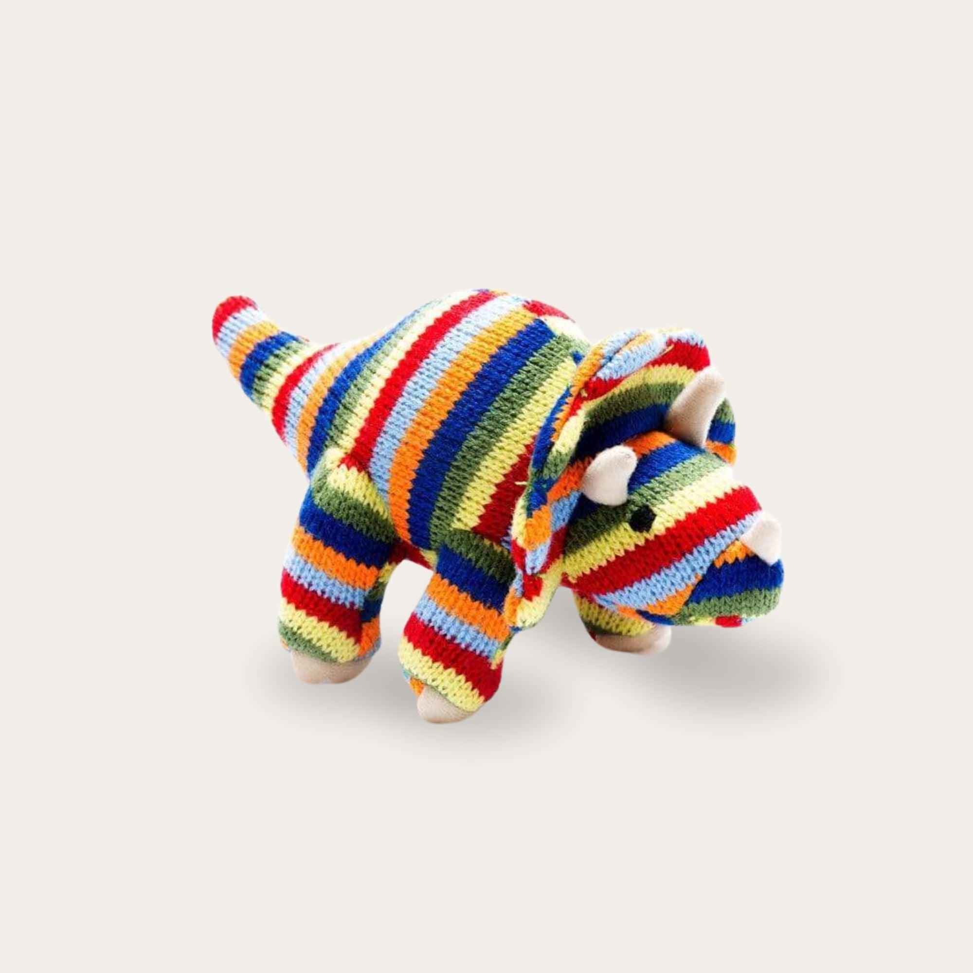 Dinosaur soft toy with colourful stripes.