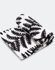 Large white organic muslin with a black fern sensory pattern to help aid babies eye and brain development