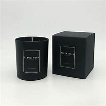 A beautiful smelling candle in a black jar