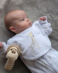 giraffe cotton baby clothing set on a newborn baby