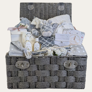 giraffe themed new baby gifts basket with blanket, giraffe soft toy and clothing