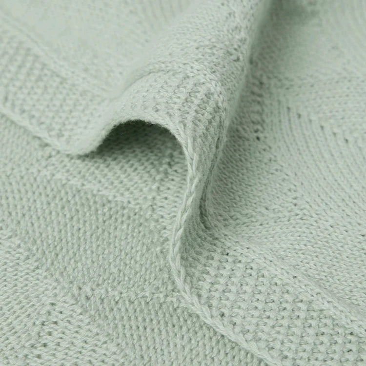 unisex baby shell knit blanket in a soft sea foam green colour