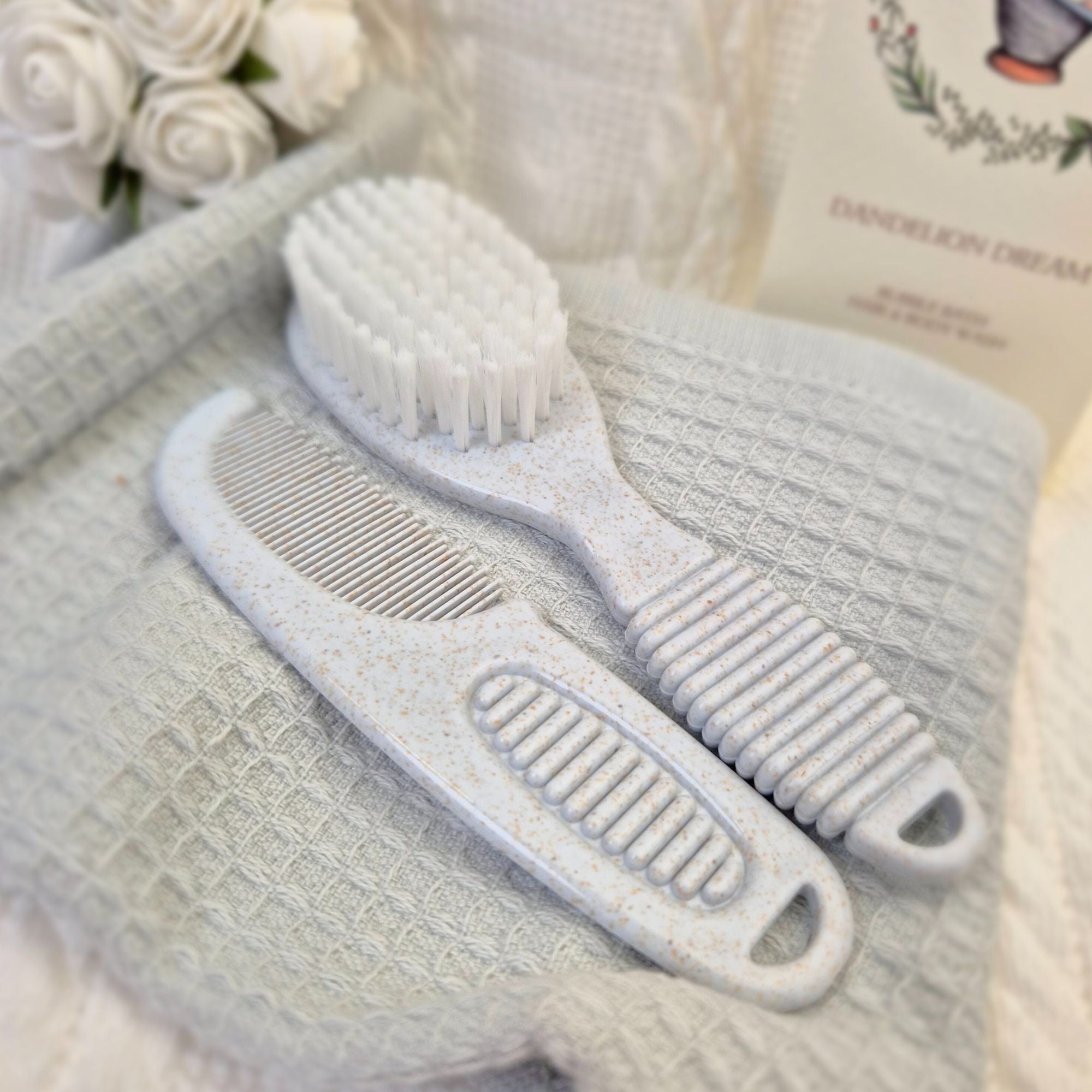 Grey deluxe baby brush and comb set made from 80% PP and 20% wheat fibre, gentle and eco-friendly for delicate baby grooming. 