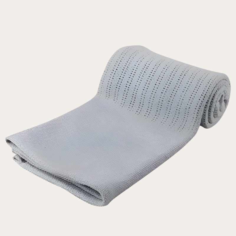 Personalisable grey Cotton Cellular Blanket in use, covering a sleeping baby.