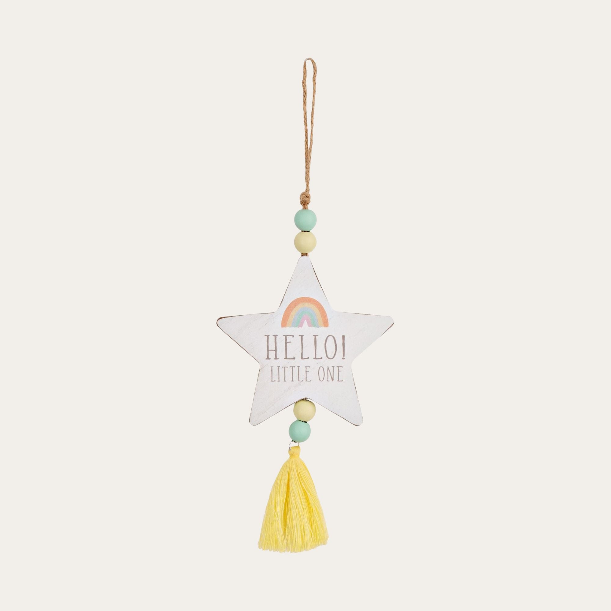 A star hanging on beaded thread with a small rainbow and 'hello little one' written in the star.