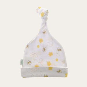 Adorable baby white knot hat with bee and honeycomb print in yellow. Ideal for spring and summer. 