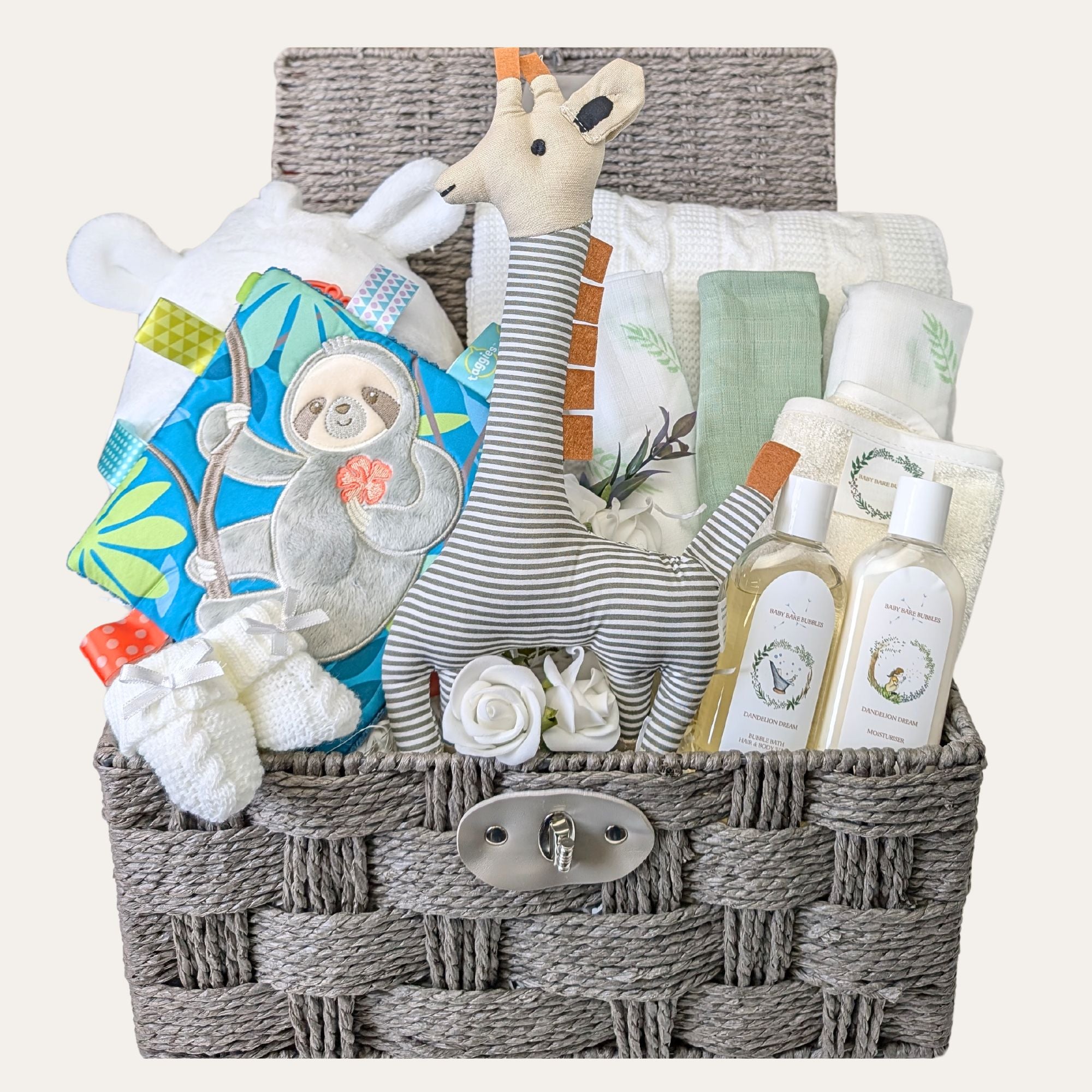 unisex baby hamper which includes baby bath robe baby knit blanket, set of muslins, organic skincare and some baby toys.