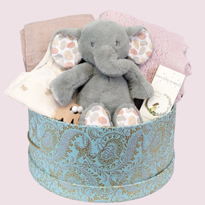 large baby gifts box with cashmere blanket in pink, organic cotton muslin, large elephant soft toy, clothing and skincare.