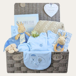 Large peter rabbit baby boy gifts hamper with beige blanket, journal and clothing.