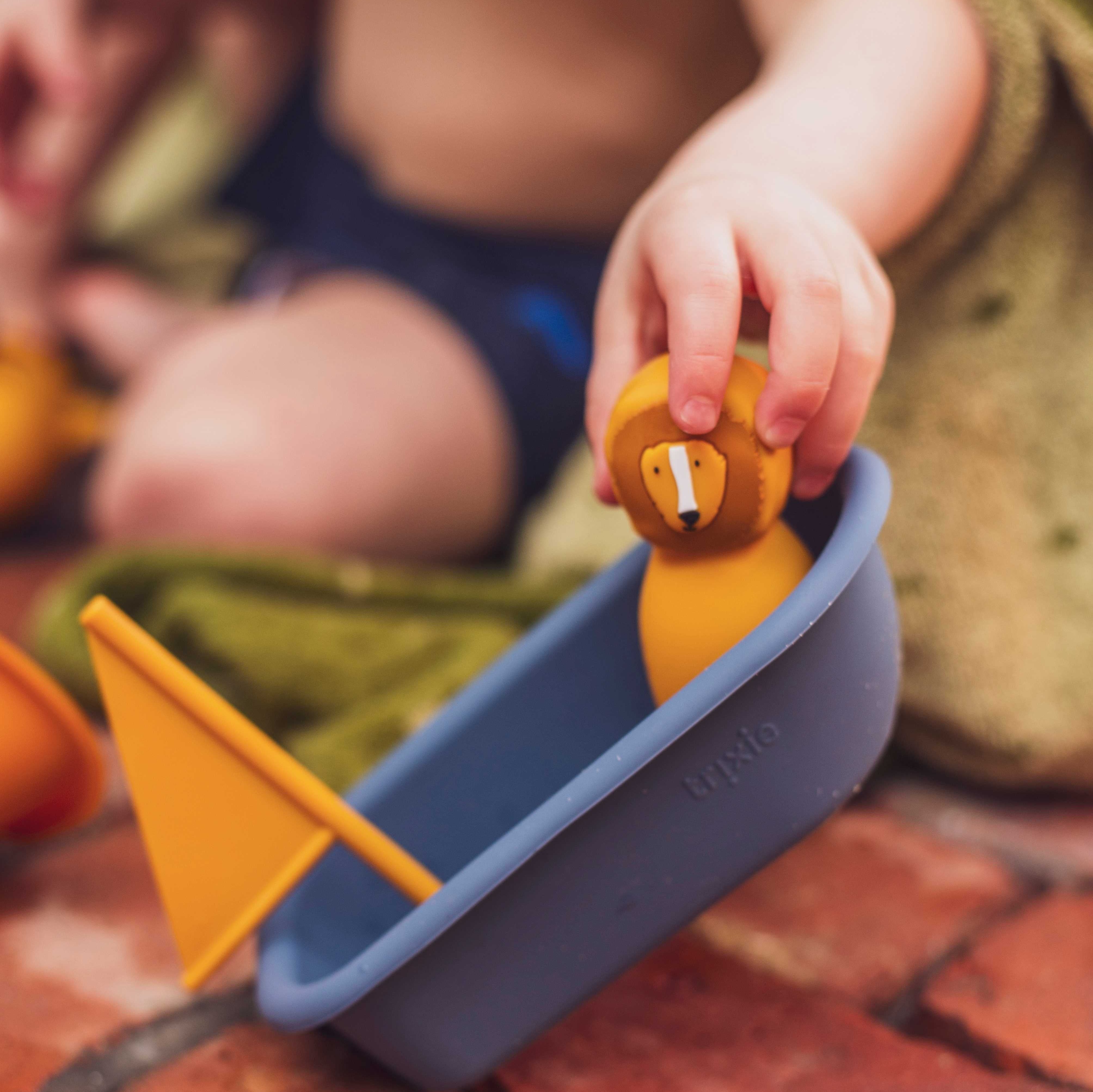 Mr. Lion’s silicone sailboat bath toy, BPA-free, safe for babies and toddlers; ideal for sensory play and learning about floating and sinking.