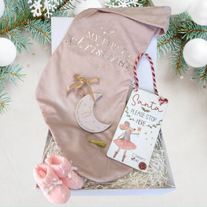 baby girl hamper gift with stocking, plaque, baby booties and santa please stop here sign.