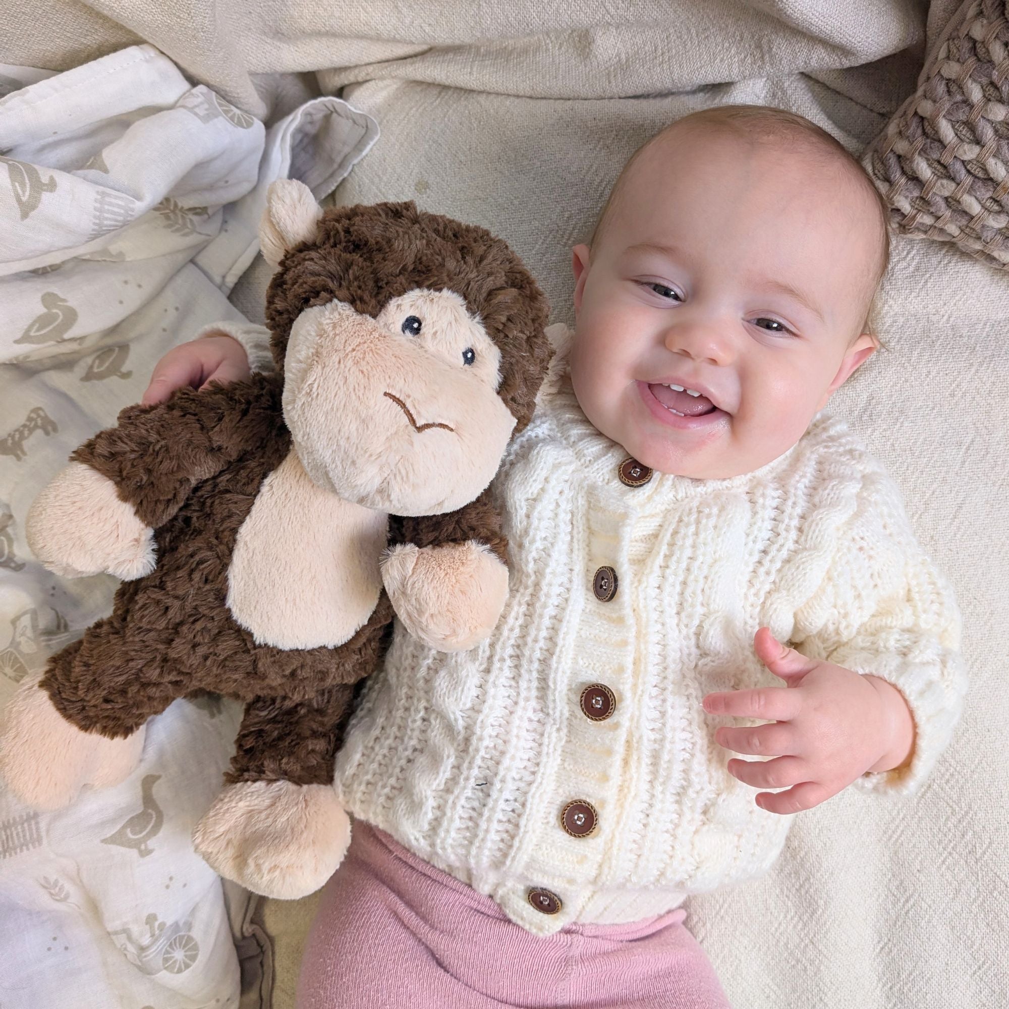 monkey soft toy for a baby in brown