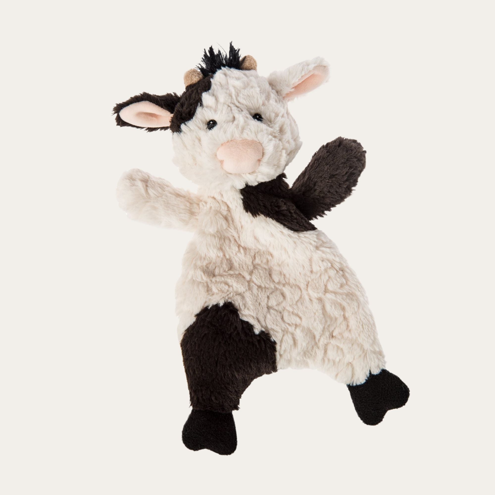 black and white moo moo cow comforter toy.