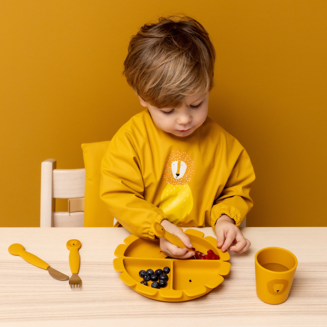 Mr Lion uction Plate for infants, featuring a secure suction base, compartments for different foods, and made from 100% food-grade silicone. Perfect for reducing spills and encouraging healthy eating habits