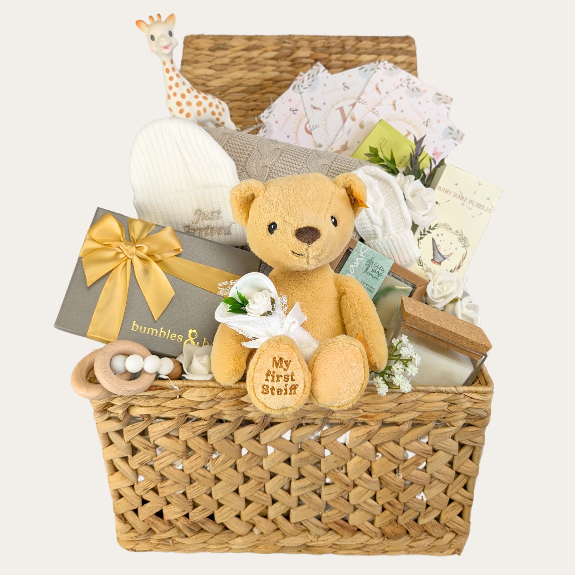 baby gifts basket with teddy bear baby hat blanket teething toy candle and skincare bumbles and boo