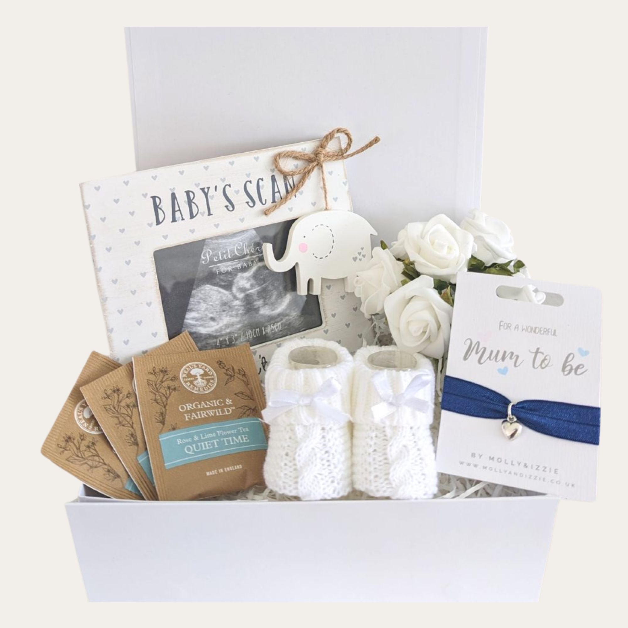 mum to be gift hamper with a baby scan frame, mum to be bracelet, baby knit booties and quiet time tea.