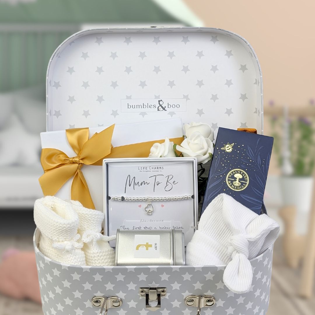 mum to be gift hamper keepsake with organic skincare, silver bracelet, baby booties, baby hat and chocolates.