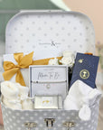 mum to be gift hamper keepsake with organic skincare, silver bracelet, baby booties, baby hat and chocolates.