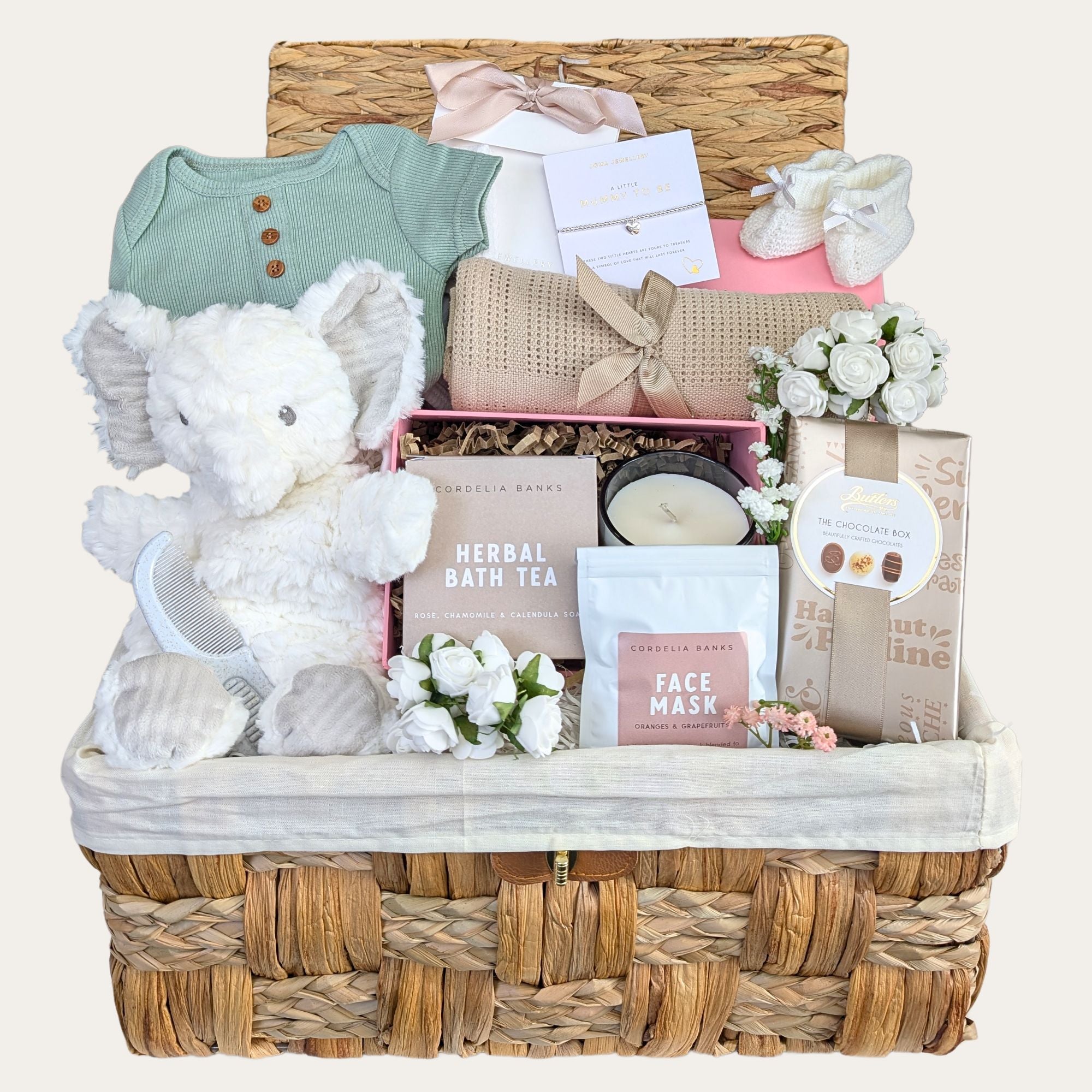 mum to be pamper hamper with silver charm bracelet, organic skincare, chocolates and baby clothing. Bumbles and Boo.