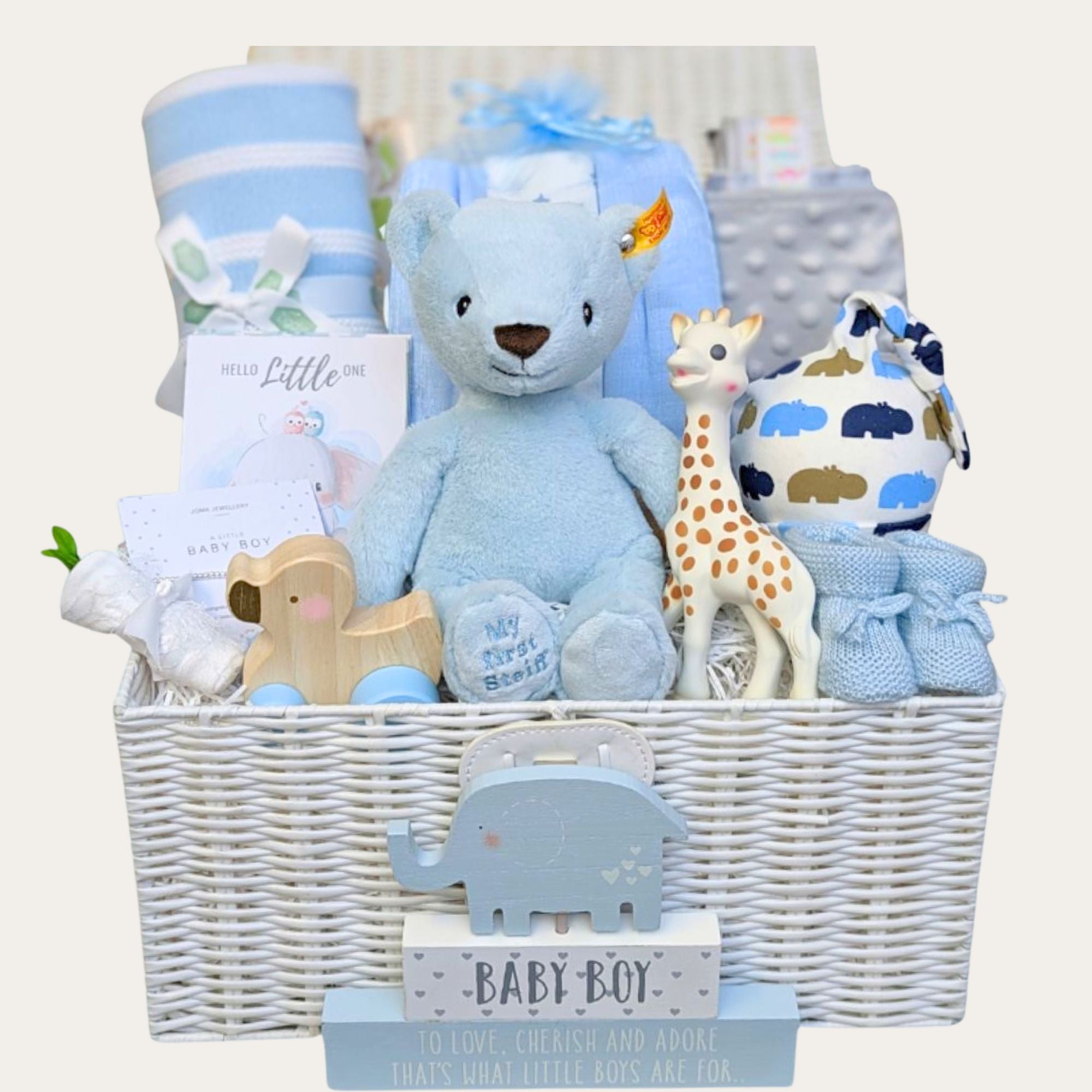 baby boy gifts hamper with blue steiff bear, blanket, sophie la giraffe, wooden toy and baby milestone cards. Bumbles and Boo.