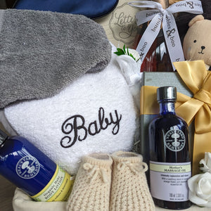 Close up of neals yard products and personalisation in a mum and baby hamper.