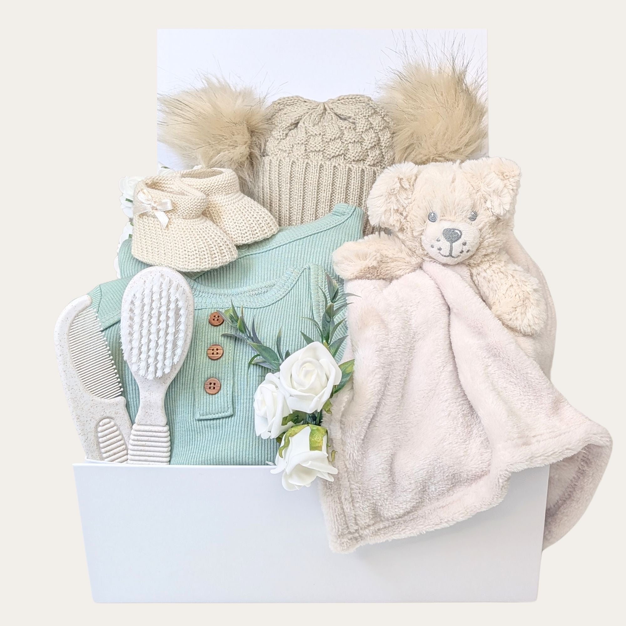 Neutral baby gifts box, contains sage cotton clothes, cosy blanket & muslin. Hamper by Bumbles and Boo.