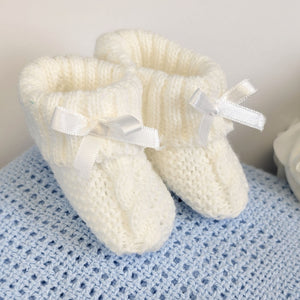 White baby booties.