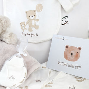 Baby clothing set in cream and brown with a bear design and gift card.