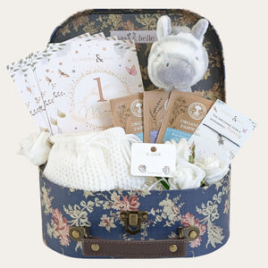 new baby gifts hamper with zebra toy, baby milestone cards, organic tea, silver earrings and bracelet.