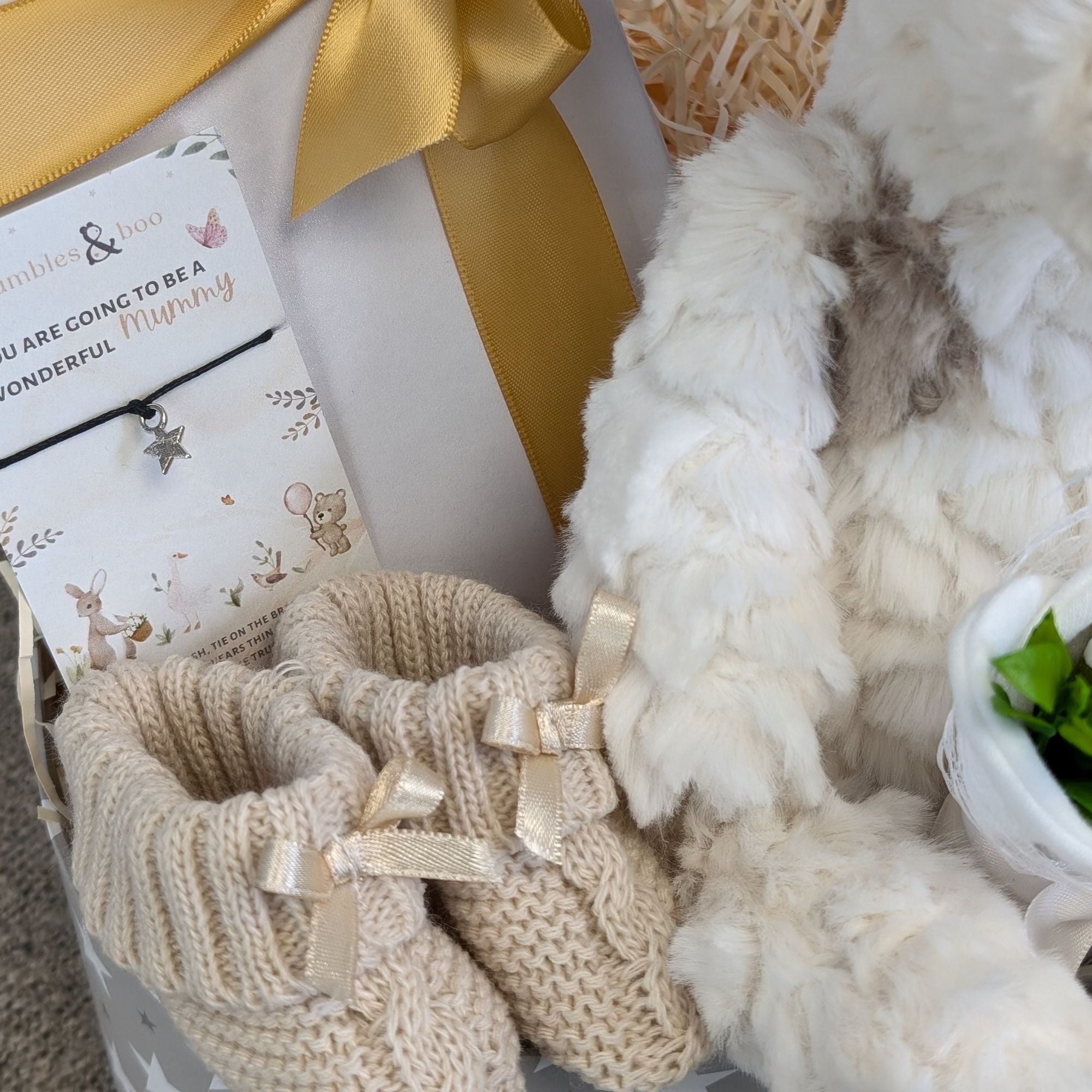 new baby gifts box with giraffe and blanket plus chocolates and gift for mum.