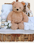 baby gifts hamper with steiff teddy bear, baby blanket, wooden toy and sophie giraffe teething toy.