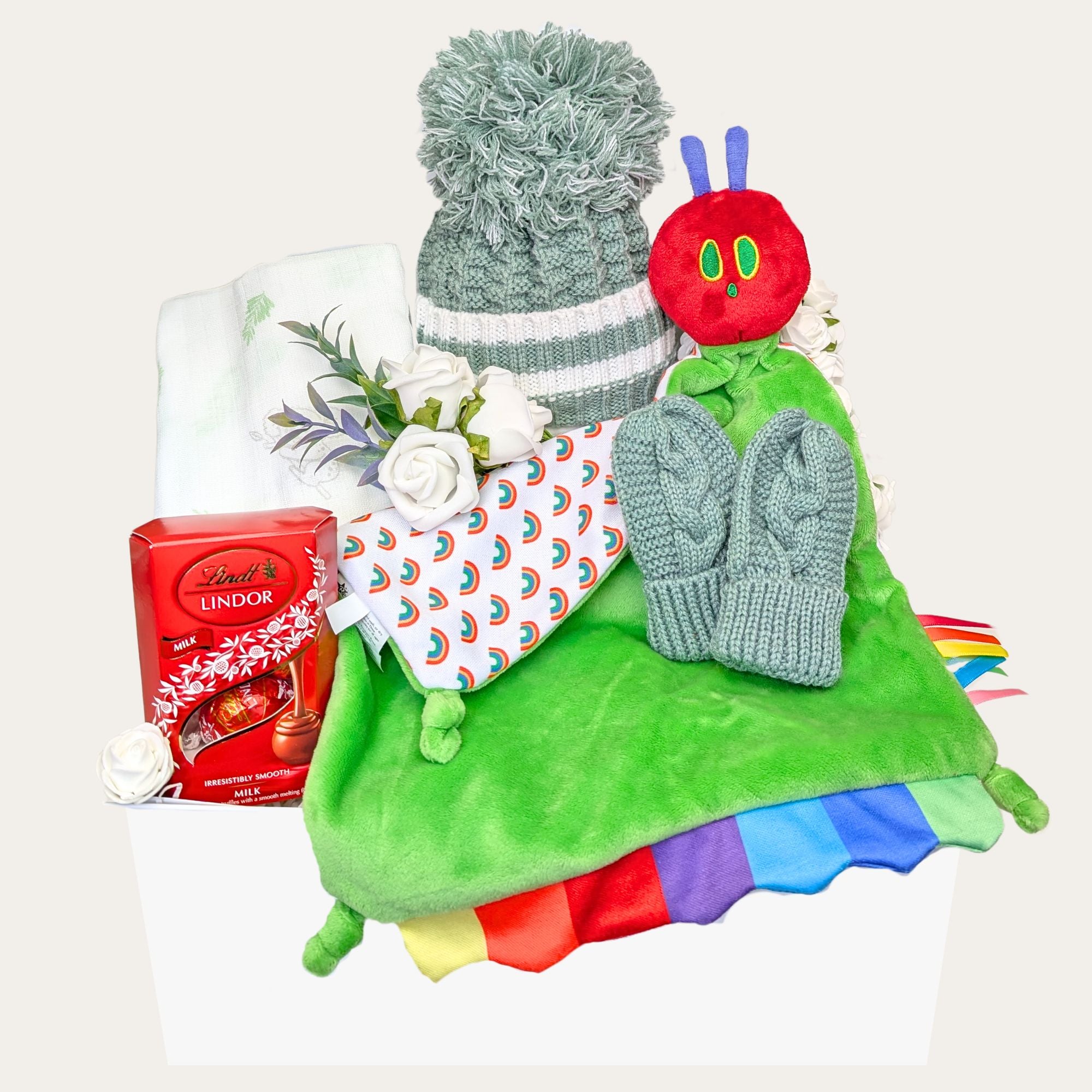 New Mum and Baby Gift Hamper with a sage green knit hat, matching mittens, Very Hungry Caterpillar sensory comforter, cotton muslin square, and a mini chocolate treat for Mum or Dad. Bumbles and Boo.