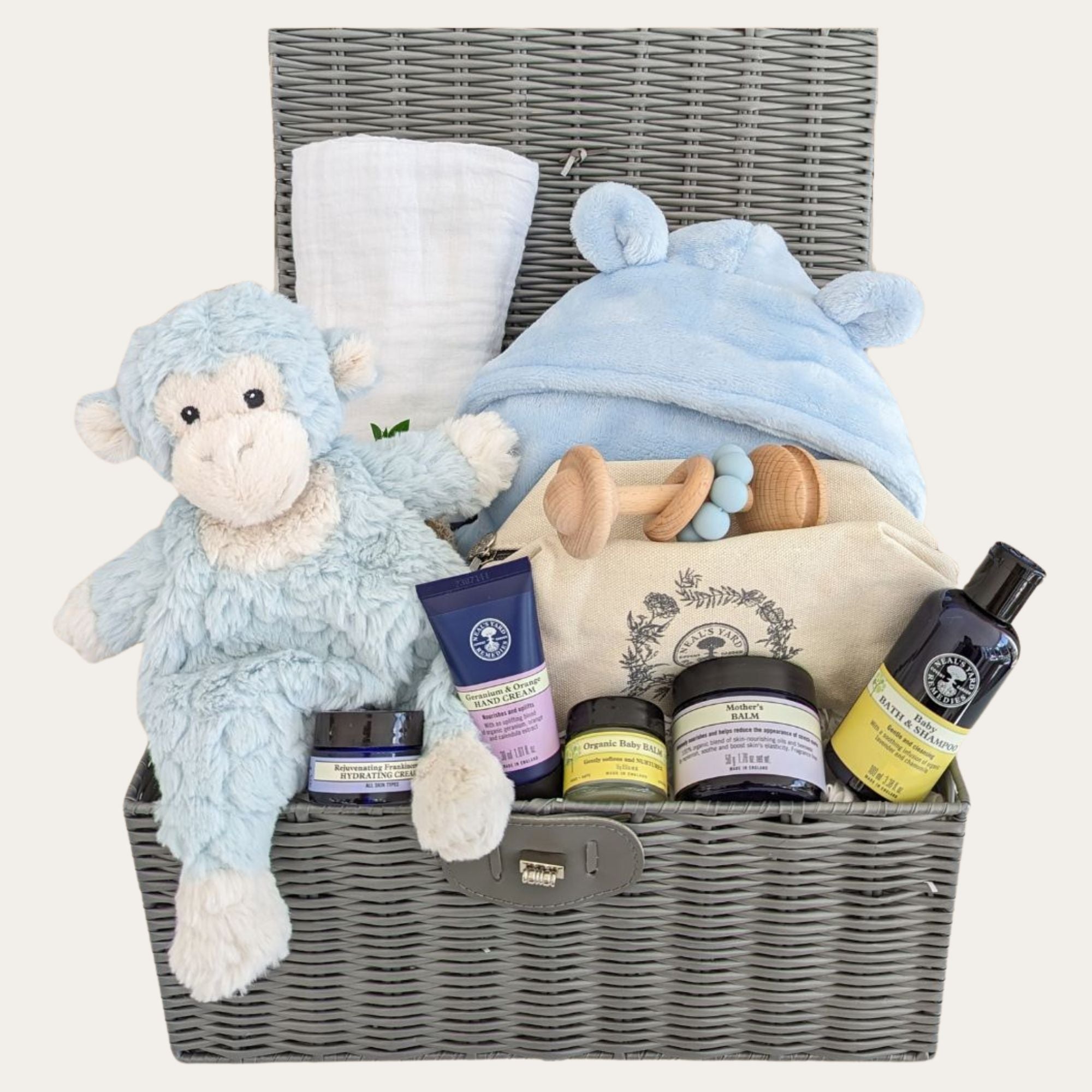 new mum hamper gifts with monkey soft toy, muslin wrap, dressing gown, baby teething toy and neal's yard remedies.