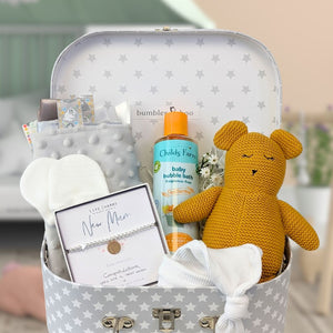 new mum gift hamper trunk with mustard teddy bear, silver bracelet for mum, organic wash and baby essentials.