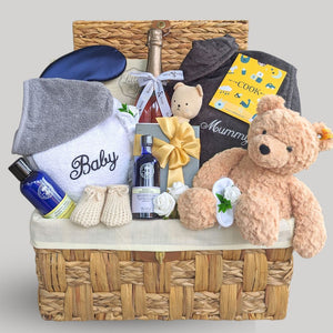 This new mum gift hamper features a bathrobe for both Mummy and baby, organic skincare, chocolates, and a beautiful Steiff teddy bear, ensuring a thoughtful and delightful experience for the new family.